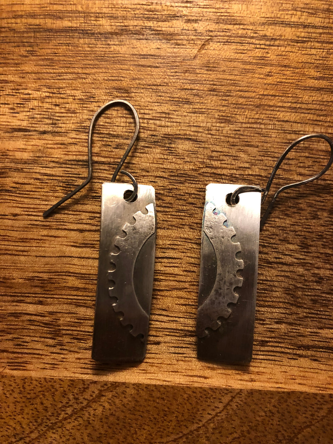 Sterling silver bar earrings with gear accent